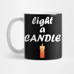 light a candle Mug